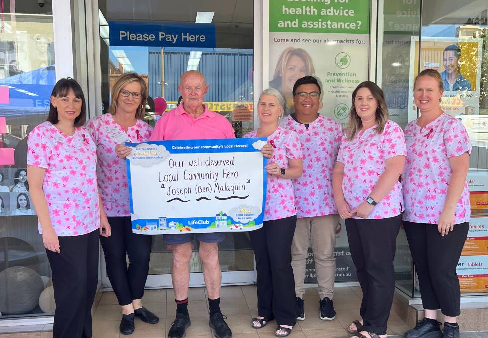 Inverell Pharmacy staff present Benny Malaquin with his Local Hero award. 