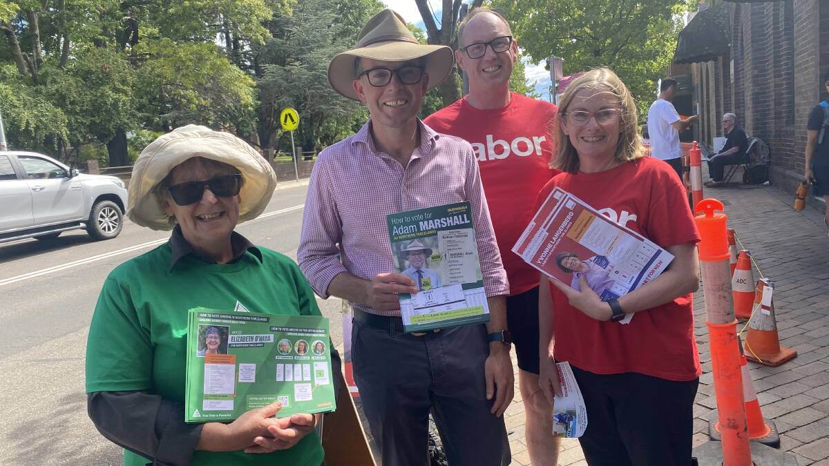 Greens candidate Elizabeth O'Hara, Nationals MP Adam Marshall, Labor volunteers Sean Maguire and Caroline Chapman outside Armidale Town Hall on March 23. Picture by Laurie Bullock