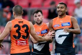 GWS have scored a 22-point win over Port Adelaide, with Callum Brown (R) snaring two goals. (Steven Markham/AAP PHOTOS)